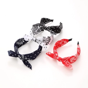 Colorful paisley fabric headbands with bunny ear bows in red, navy, white and black colors