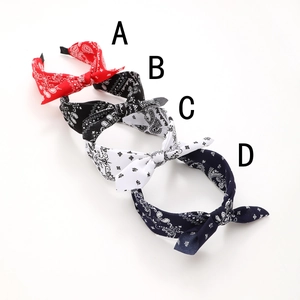 Bohemian paisley fabric bow headbands set in red, black, white, and navy blue colors