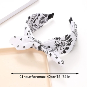 Detail view of paisley bow headband showing 40cm circumference and soft fabric texture