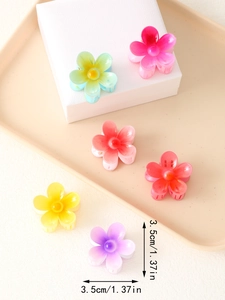 Close-up of 3.5cm mini flower hair claws in six vibrant gradient matte colors