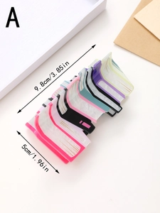 Detail view of book-shaped acrylic hair claw clip with size dimensions 3.85 x 1.96 inches