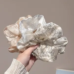 Three-piece large floral satin hair scrunchies with elegant rose print in champagne gold