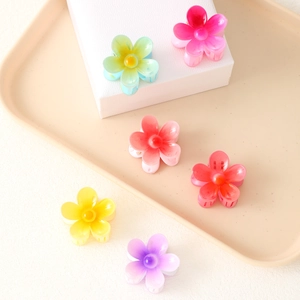 Set of six colorful floral claw clips in resin for elegant beach resort hairstyling