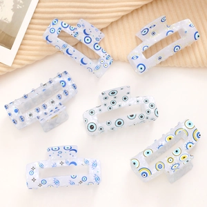 Lot de six pinces à cheveux rectangulaires avec motifs œil bleu sur base blanc translucide
