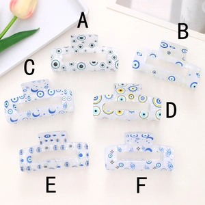 Lot de six pinces à cheveux avec motif œil grec et étoiles sur fond blanc transparent