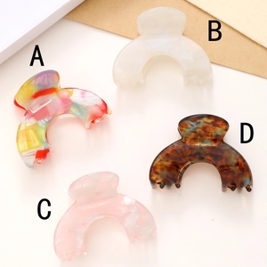 Set of four minimalist acetate hair claws in colorful marble and tortoise shell patterns