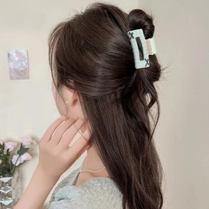 Floral plaid hair claw clip with black bow accessory for women's elegant half-up hairstyle