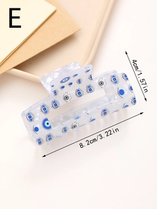 Détails des dimensions de la pince à cheveux œil bleu sur un support minimal