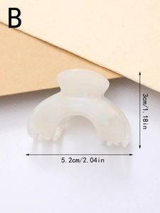 Detailed size view of the small iridescent white acetate hair claw clip, 5.2cm width