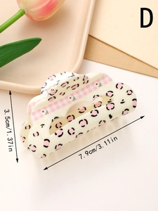 Detail view of floral and plaid bow hair claw clip with specific dimensions 7.9cm x 3.5cm