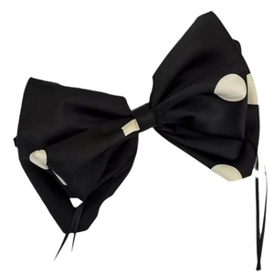 Elegant satin bow hair clip with black and white polka dots and long decorative ribbons