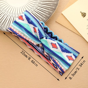 Detail showing dimensions 22cm x 8.5cm of colorful geometric bohemian stretch headband