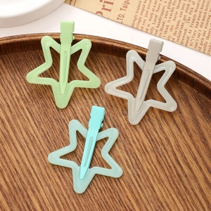 Star-shaped jelly color hair clips in pastel green, blue, and grey for women