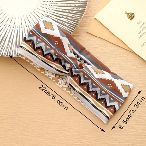 Detail showing bohemian headband dimensions 22cm by 8.5cm on a rustic wooden background