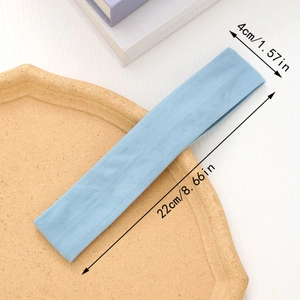 Detail showing dimensions of light blue elastic sports headband 22cm length 4cm width