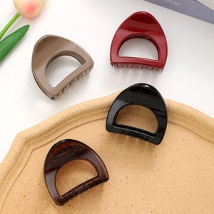 Elegant semi-circular claw clips set in khaki, burgundy, black, and amber gloss finish