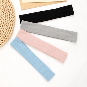 Set of four elastic non-slip sports headbands in black, grey, pink and blue colors
