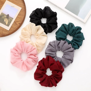 Set of six pleated chiffon scrunchies in diverse colors for minimalist hairstyles