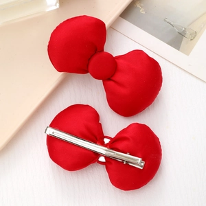 Pair of red satin bow hair clips with silver metal alligator clips for women and girls