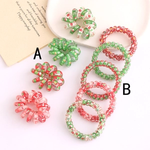 Lot de chouchous spirales de Noël avec motifs de fêtes rouges et verts sur fond blanc