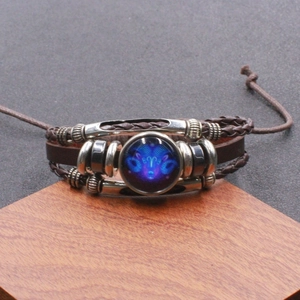 Lichtgevende Ram sterrenbeeld gevlochten lederen armband met blauwe glazen bedeltje
