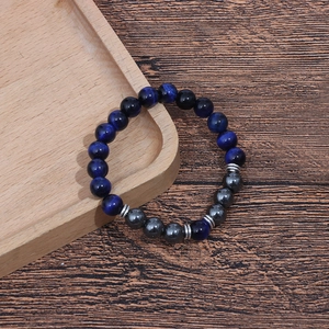 Tiger eye and hematite 8mm beaded couple bracelet with silver spacers on wood