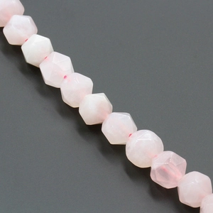 Macro shot of faceted natural rose quartz beads in soft pink for DIY jewelry making