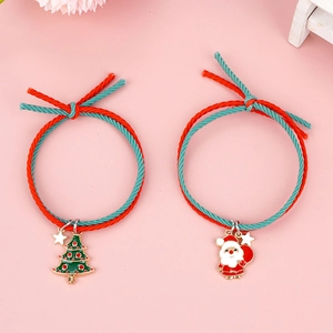 Weihnachts-Haargummis-Set in Rot und Grün mit Anhängern von Weihnachtsmann und Baum