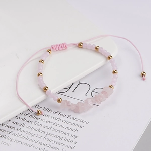 Handmade woven pink bracelet with natural crystal stones and gold beads for beach surf