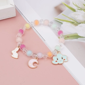 Detail of colorful macaron beaded bracelet with cute rabbit, moon and cloud charms
