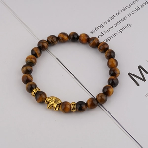 8mm tiger eye stone beaded bracelet with golden elephant charm and vintage spacers