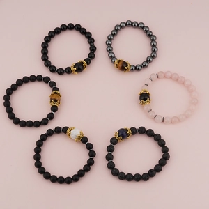 Men's luxury charm bracelets with crown accents and natural tiger eye stone beads