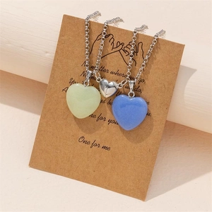 Luminous hexagonal pillar pendant with magnetic heart necklaces on gift message card