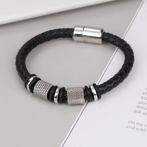 Men's multi-layer braided leather bracelet with silver alloy magnetic clasp on gray background