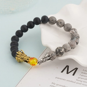 Fashion dragon beaded bracelet with lava stone and tiger eye beads on white tray