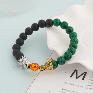 Beaded bracelet with dragon heads, lava stones, tiger eye and white turquoise beads