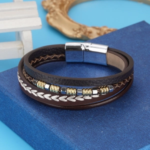 Detailed close-up of multilayer men's braided leather bracelet with stainless steel magnetic clasp