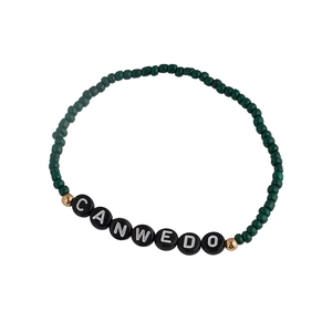 Bohemian dark green beaded bracelet with golden spacers and CANWE DO letter beads