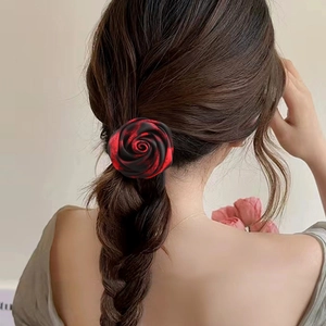 Elegant red and black gradient satin rose hair tie accessory shown in a hairstyle