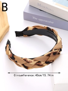 Detail showing the braided leopard print texture and non-slip inner teeth of the headband