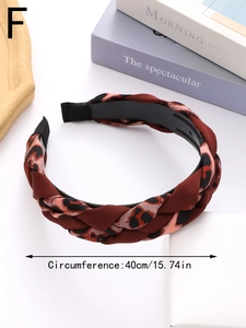 Macro detail of braided leopard print headband with anti-slip inner plastic teeth grip