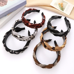 Set of six braided leopard print headbands in assorted colors with non-slip tooth design