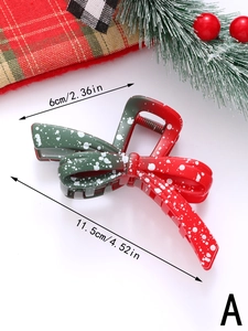 Detailed view of red and green gradient Christmas hair claw with snowflake patterns