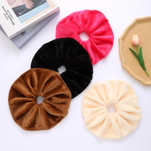 Oversized velvet scrunchies set in pink black brown and beige for elegant hairstyling