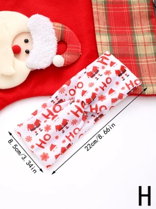 Detailed view of Christmas knotted headband with dimensions 22x8.5cm and Santa print
