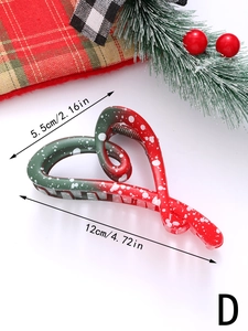 Detail view of 12cm Christmas hair claw clip with red and green gradient snowflake pattern