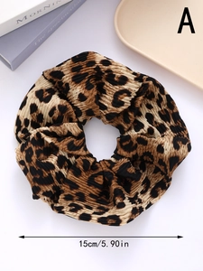 Macro view of leopard print hair scrunchie with pleated texture and 15cm diameter size