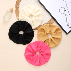 Oversized absorbent towel scrunchies set in four colors for hair care and styling