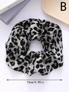 Close-up of leopard print hair scrunchie with 15cm diameter size detail and soft texture