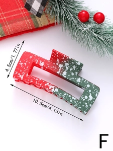 Detailed view of a 10.5cm Christmas hair claw clip with festive snowflake patterns